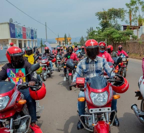 Illustration of motorcycle taxis on a Kigali boulevard
